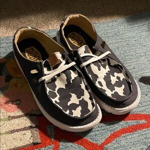 HeyDude Black and White Cow print Women’s size 9